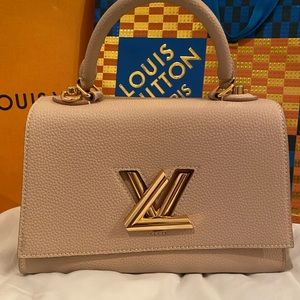 Louis Vuitton one handle twist lock leather in greige